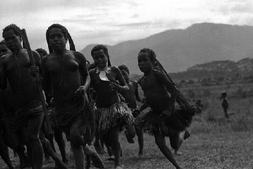 Samuel Putnam negatives, New Guinea; women running clockwise direction