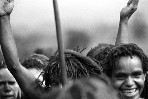 Samuel Putnam negatives, New Guinea; head of a woman; arms upraised; dancing