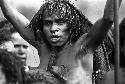 Samuel Putnam negatives, New Guinea; head of a woman; arms upraised; dancing