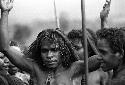 Samuel Putnam negatives, New Guinea; head of a woman; arms upraised; dancing