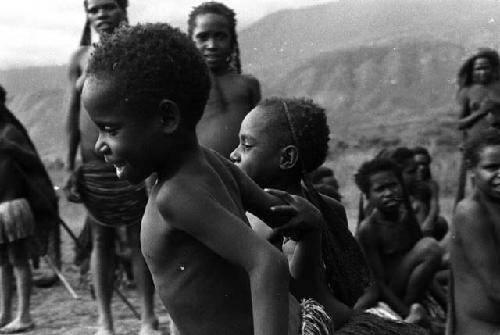 Samuel Putnam negatives, New Guinea; children watching dance on Liberek during Etai