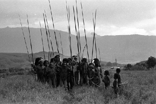 Samuel Putnam negatives, New Guinea; a men's group coming toward the Liberek