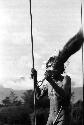 Samuel Putnam negatives, New Guinea; man dancing with spear in his hand; shouting at the enemy on the Warabara