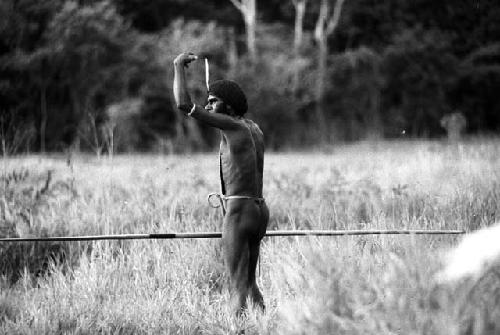 Samuel Putnam negatives, New Guinea; man holding a spear at the end of the Warabara
