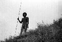 Samuel Putnam negatives, New Guinea; man holding a spear at the end of the Warabara