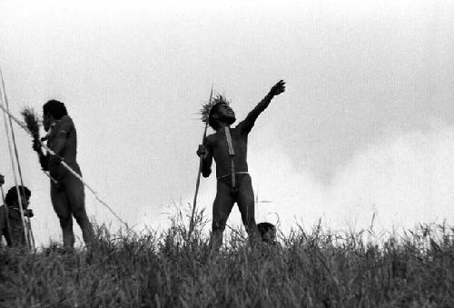 Samuel Putnam negatives, New Guinea; several warriors shouting and pointing at the enemy