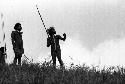 Samuel Putnam negatives, New Guinea; several warriors shouting and pointing at the enemy