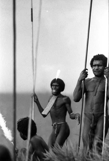 Samuel Putnam negatives, New Guinea; men dancing on the end of the Warabara; about 4 men holding onto their spears