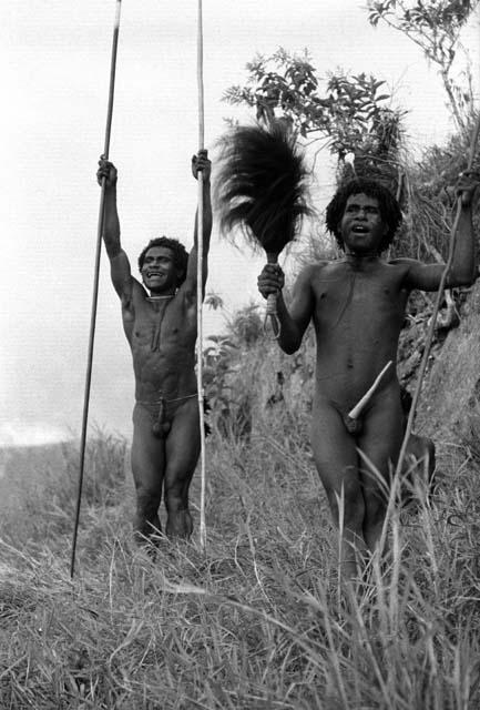 Samuel Putnam negatives, New Guinea; 2 men jirring at the enemy