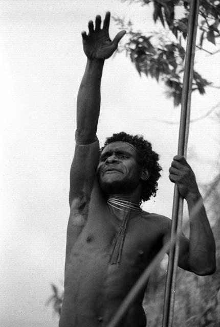 Samuel Putnam negatives, New Guinea; one man shouts at the enemy