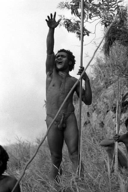 Samuel Putnam negatives, New Guinea; one man shouts at the enemy