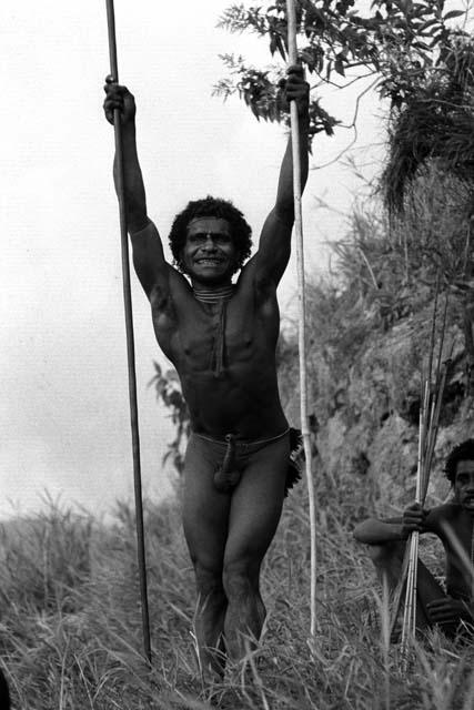 Samuel Putnam negatives, New Guinea; one man shouts at the enemy