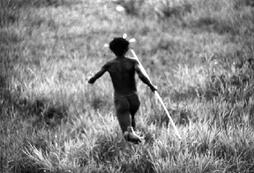 Samuel Putnam negatives, New Guinea; man running down towards the enemy on Warabara