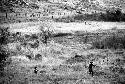 Samuel Putnam negatives, New Guinea; men in frgd; running back towards the WW; Wittaia going home in t he far distance