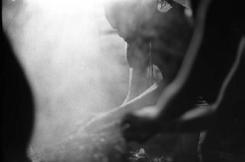 Samuel Putnam negatives, New Guinea; 2 women working on hakse inside of lise