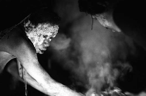 Samuel Putnam negatives, New Guinea; 2 women working on hakse inside of lise