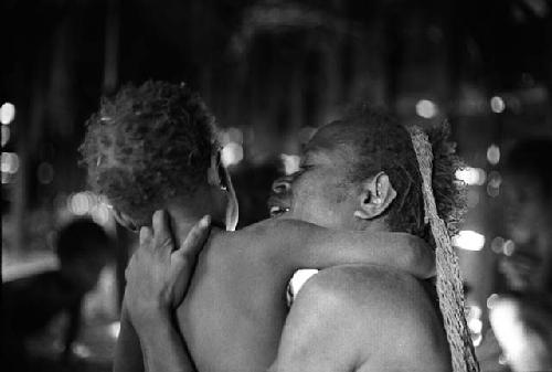 Samuel Putnam negatives, New Guinea; woman and child wrestling very gently