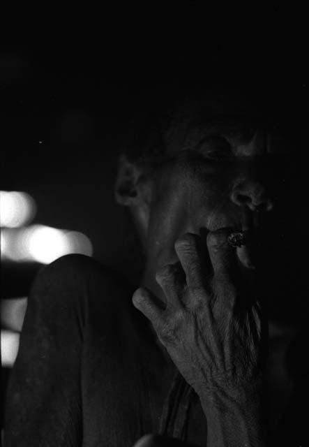 Samuel Putnam negatives, New Guinea; Aneake smoking a cigarette