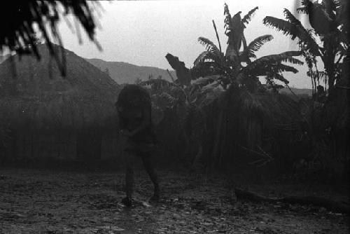 Samuel Putnam negatives, New Guinea; Woman crossing a sili