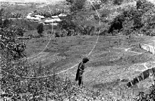 Karl Heider negatives, New Guinea;  Lokoparek; woman walks in a field