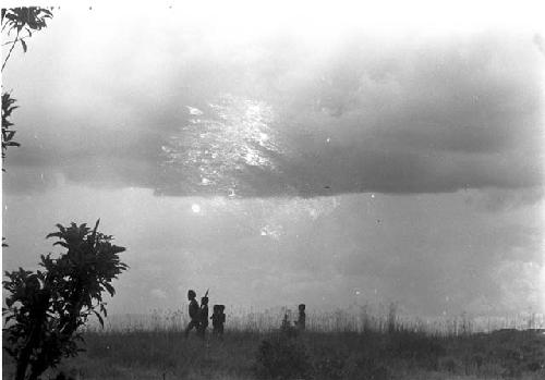 Karl Heider negatives, New Guinea; Figures Move in Distance on Tokolik