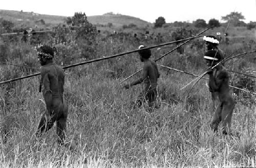 Karl Heider negatives, New Guinea; Men moving to action