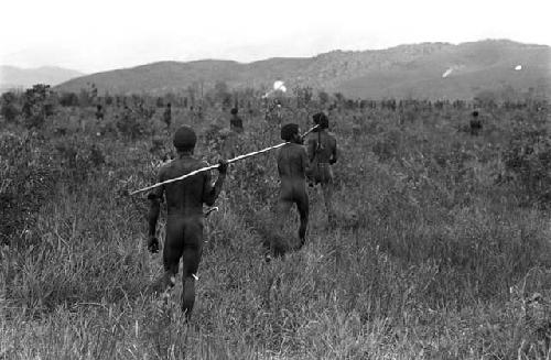 Karl Heider negatives, New Guinea; Men moving to action