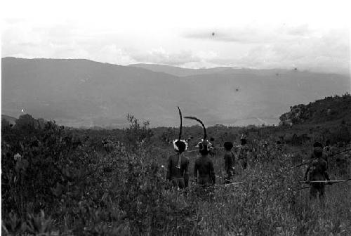 Karl Heider negatives, New Guinea; Men moving to action