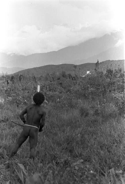 Karl Heider negatives, New Guinea; Watches his arrow