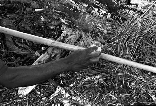 Karl Heider negatives, New Guinea; Man working on spear