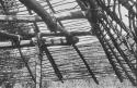 Roof construction, showing corner of roof and framework supporting it.