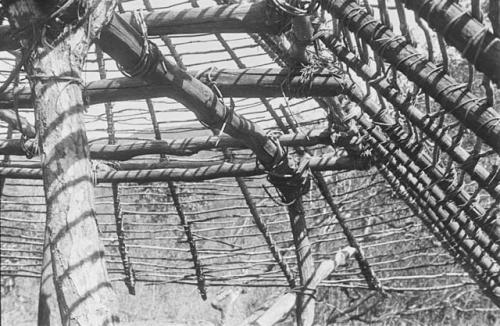 Roof construction, showing corner of roof and framework supporting it.