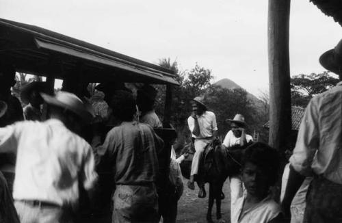 Group of Panamanians, man on horse a policeman