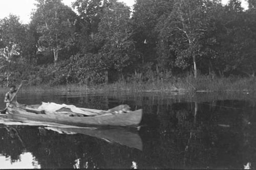 Man paddling canoe