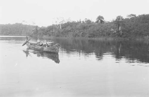 Man paddling canoe