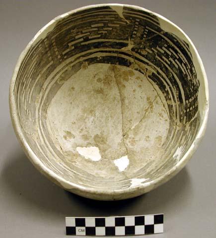 Ceramic bowl, black on white interior, reconstructed