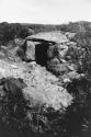 Dolmen after excavation, looking west from hill above.