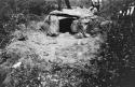 Dolmen from south showing bricks uncovered.