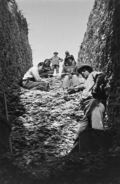 Group in trench I looking northeast from bottom pit