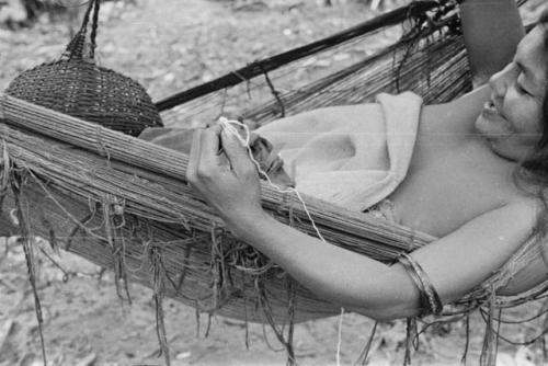 Closeup of woman showing technique of braiding girdle