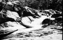 Scenes showing the process of taking korials over the great falls at Towakaima.