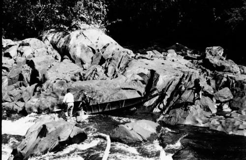 Scenes showing the process of taking korials over the great falls at Towakaima.