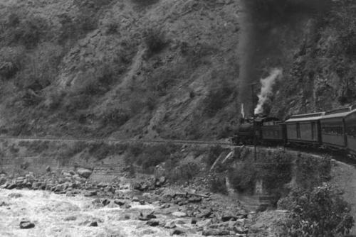 Train going up steep grade of Andes