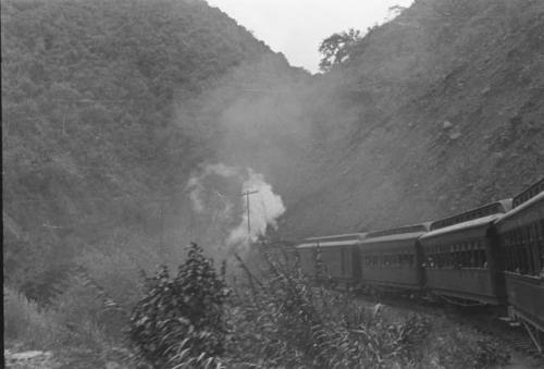 Train going up steep grade of Andes