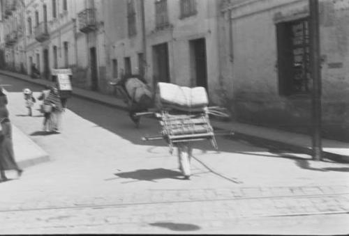 Street scene, showing method of carrying loads