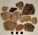Coarse earthenware body and rim sherds, some incised, some cord impressed, some rocker dentate, some punctate