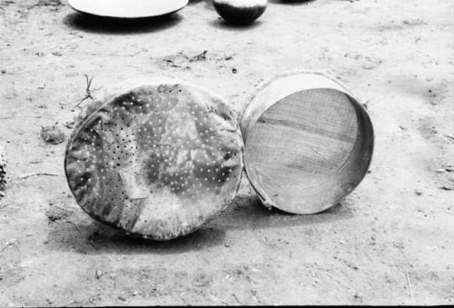 2 types of sifter -- left, perforated leather; right, basketry made from paramo grass