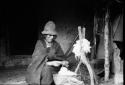 Woman spinning wool