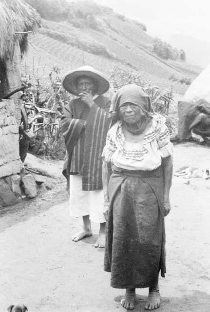 Man and woman showing costumes