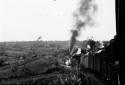 Mountain railroad showing indian riding freight